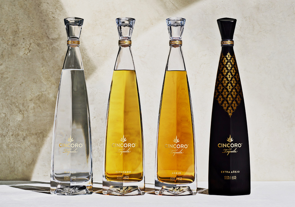 four cincoro tequila bottles in a line